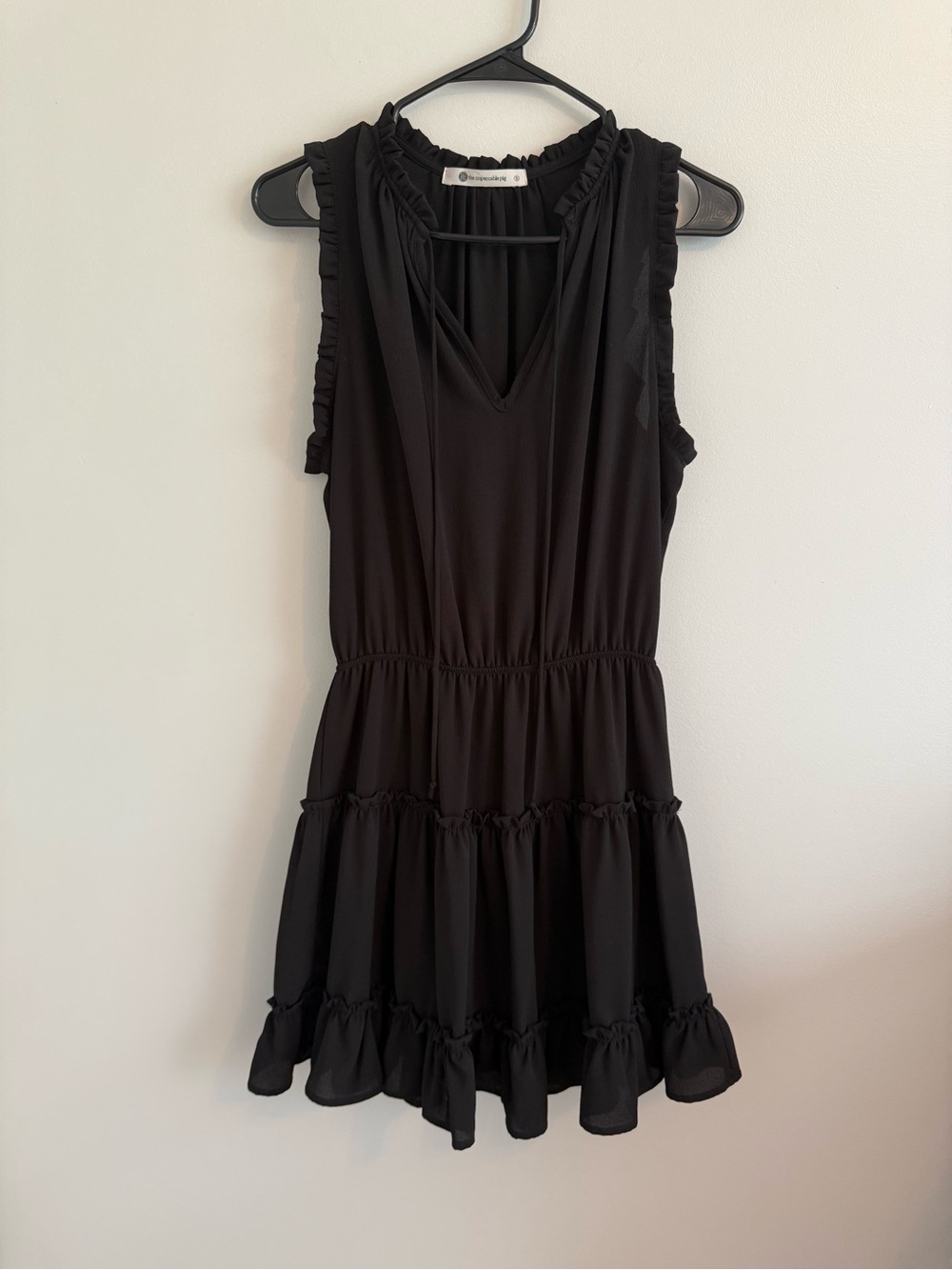 The Impeccable Pig Black Sleeveless Ruffle-Neck Blouse